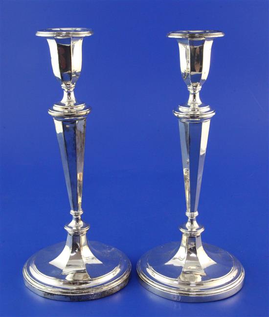 Pair of Edwardian silver candlesticks, weighted(-)